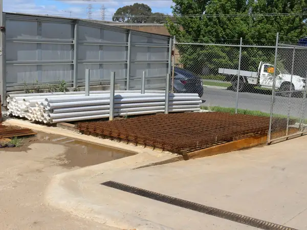 Steel reinforcing mesh, pipes and concrete stumps at the Bundoora yard