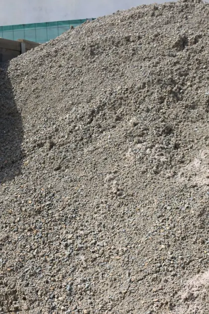 Lilly Can Topping pebbles in a bulk bay